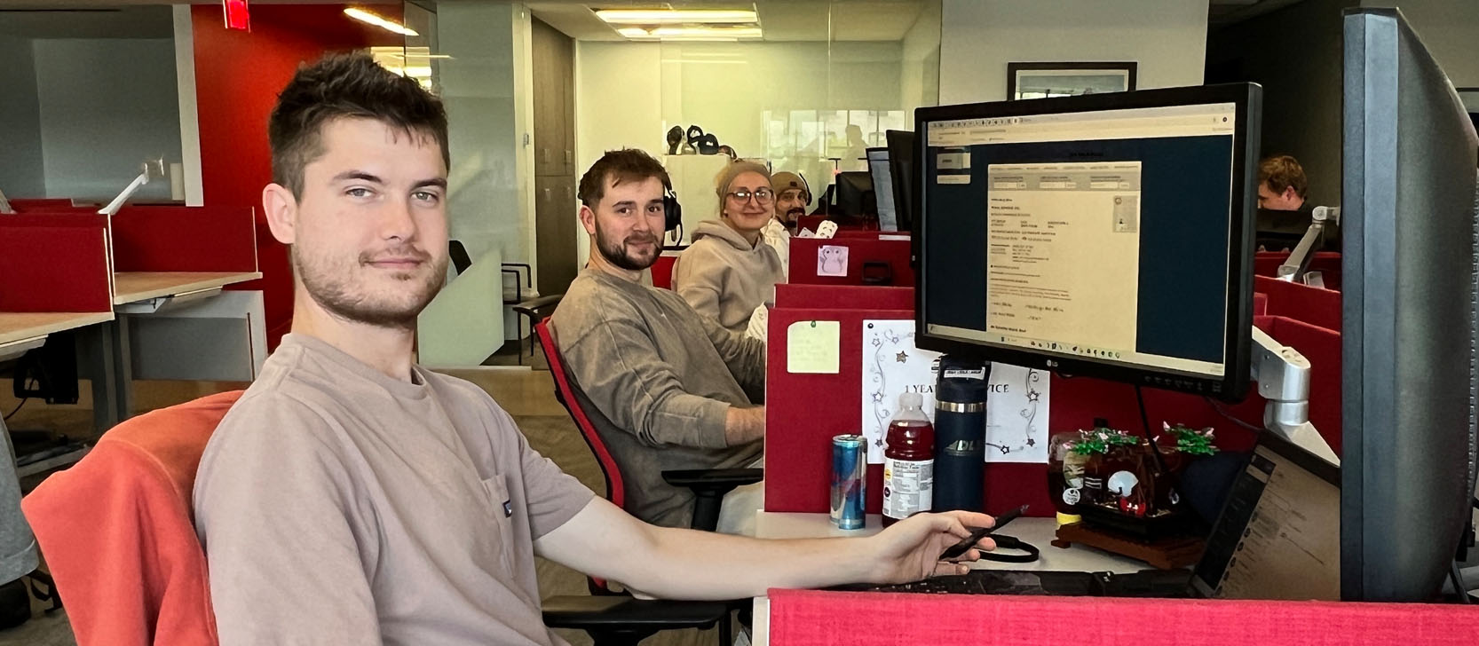 Office employee smiling with headset