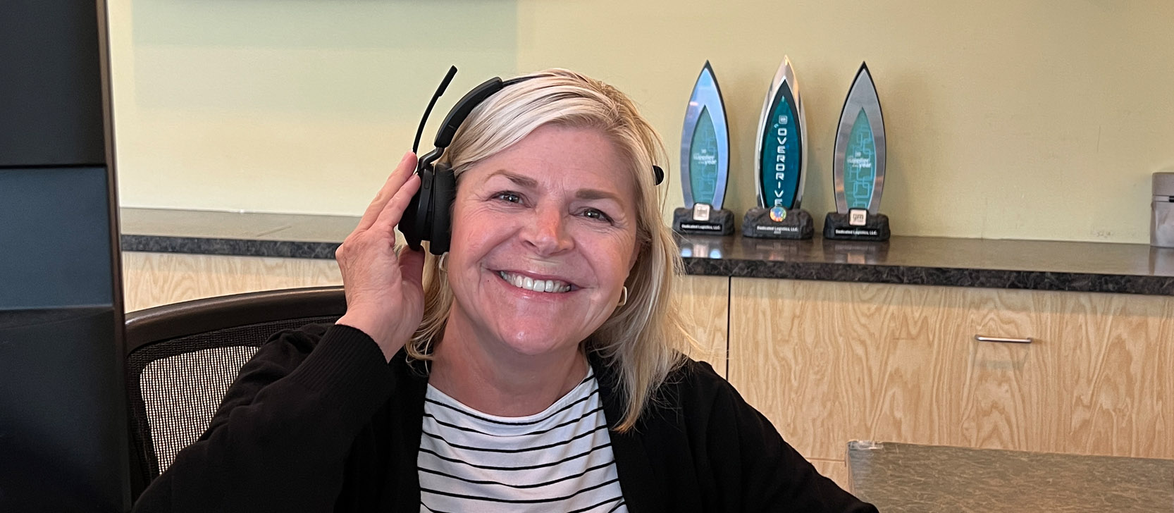 Front desk employee smiling